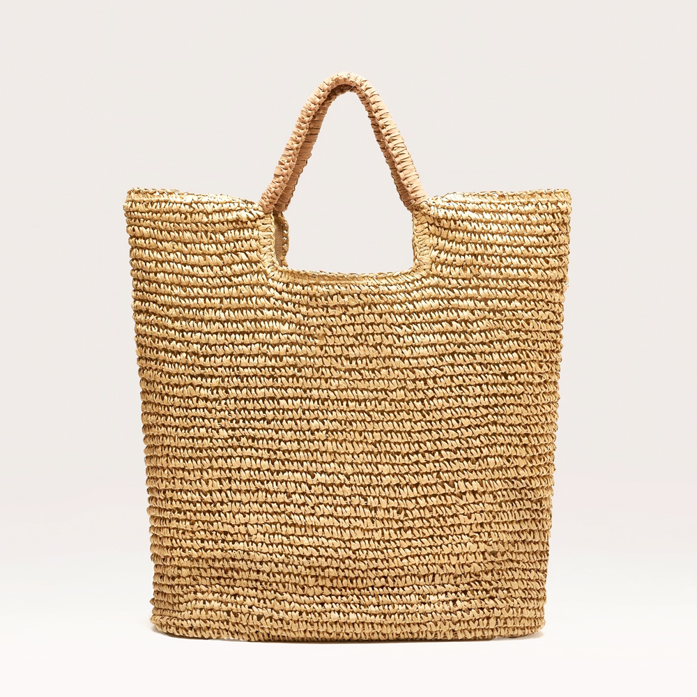 Tote style straw handbag with leather trimming 